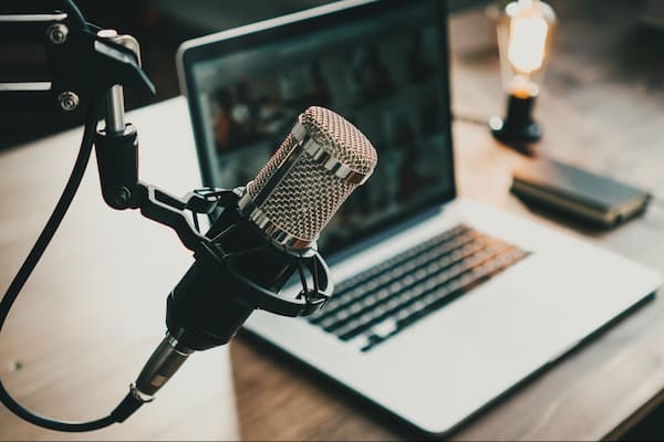 Podcast microphone and computer.