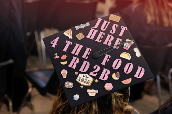 Graduation cap reading just here for the food RD2B