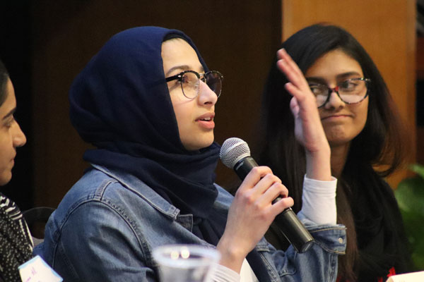 Female in hijab gives speech