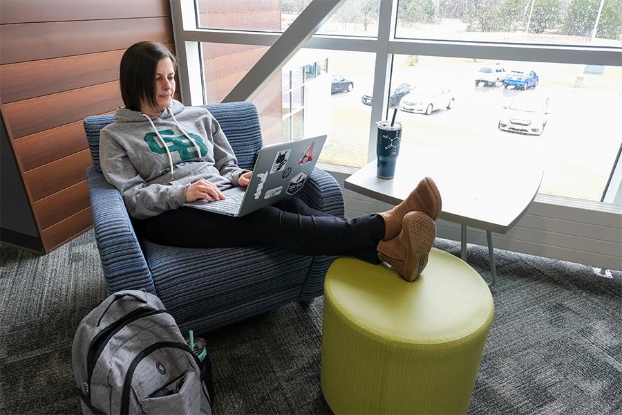 Meghan Hermann, graduate student in the Nutrition and Integrated Health program at UW-Green Bay, studies in a study knook inside the Brown County STEM Innovation Center.