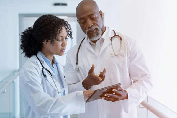 Doctors review information on tablet