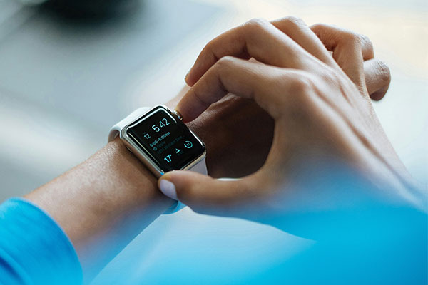 Person using a health tracker watch